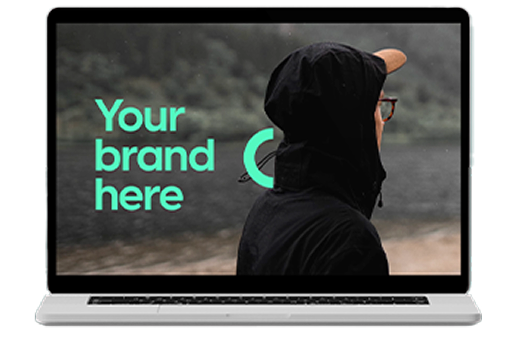 Laptop som visar en bakgrundsbild av en person i svart hoodie, med texten "Your brand here" till vänster.